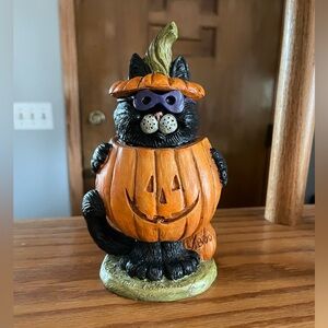 Cat in pumpkin costume by the Stone Bunny company.